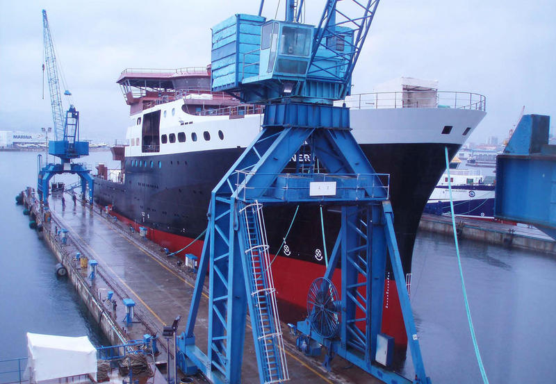 Discovery alongside an outfitting berth