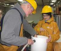 Gordon and Claire sieving mud