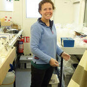 Cathy Cole filtering seawater in the laboratory container
