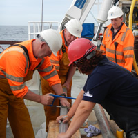 The team and crew cut in 1m long segments of the new gravity corer on the RV Celtic Explorer
