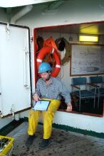 Raymond shaking a dissolved oxygen sample on RRS Discovery cruise D253 in the North Atlantic, May 2001