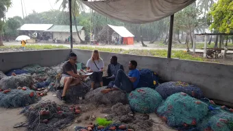Members of the project team interview local fishermen in Tanzania