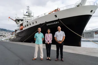 NOC's Daniel Woods, Her Majesty’s Ambassador to Portugal, Lisa Bandari, and Rui Caldeira, President of ARDITI (left to right), pictured in front of the RRS Discovery