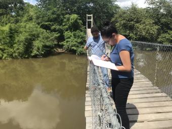 Faculty and students maintaining the Belize River Watershed river⁠ ⁠monitoring network installed as part of CME project