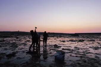 A team of scientists from NOC and the Department of Environment, Food and Agriculture (DEFA), Isle of Man Government, take intertidal sediment cores