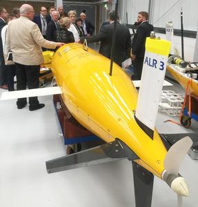  	The group touring the Marine Robotics Innovation Centre, AutosubLR in foreground