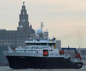 RRS Discovery passing the Liver Building, Liverpool