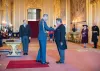 Professor Ed Hill receiving CBE insignia from HRH The Duke of Cambridge and Windsor Castle.