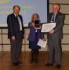 Prof. Woodworth (right) accepting the award from Prof. Markku Poutanen (left) and Prof. Susanna Zerbini (centre) of the EGU
